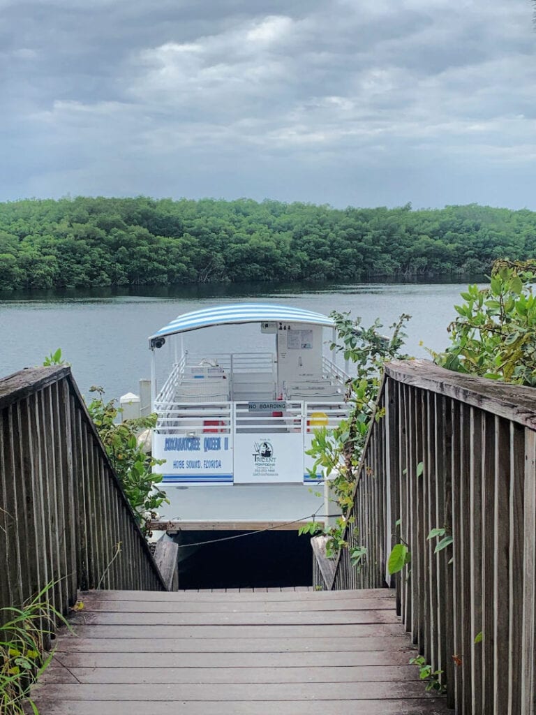 A boat parked at the dock on the Loxahatchee River