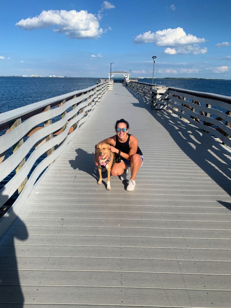 My dog and I smiling on Ballast Point fishing pier